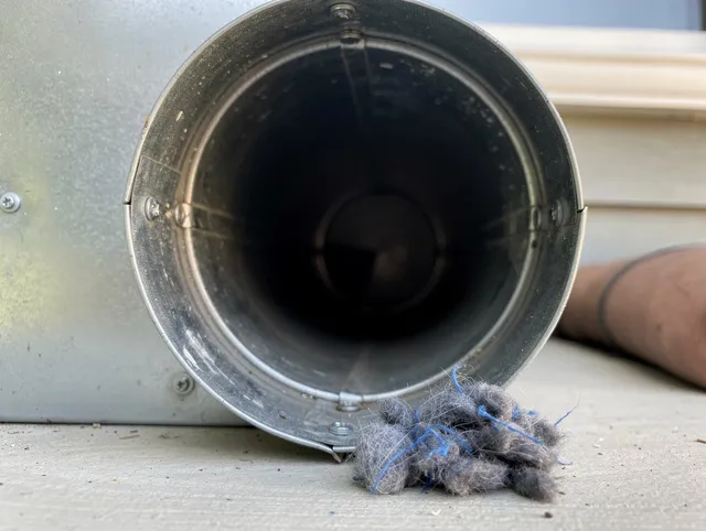 Hawthorne Dryer Vent Cleaning technician using specialized equipment to clear severe dryer vent blockage in Hawthorne